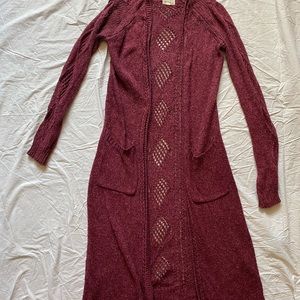 Long open knit cardigan.